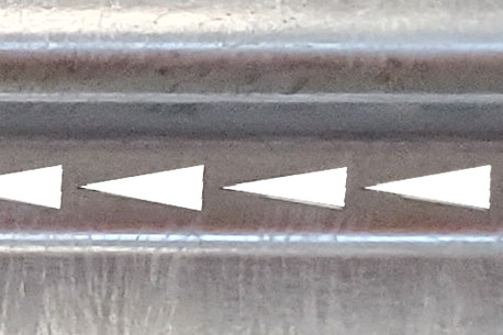 A close up image detailing the triangle shaped cutouts in the Delta TL-2+ Thrie-Beam Panels