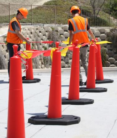 Two (2) workers setting up the Roof Edge Delineator Cone system