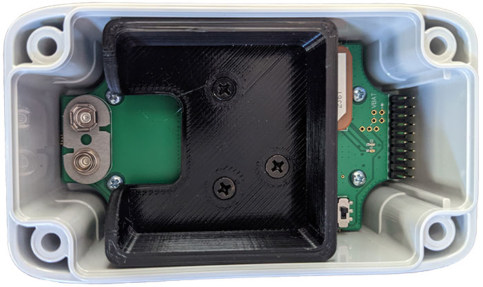 An open Sentinel Impact Tracker without its battery