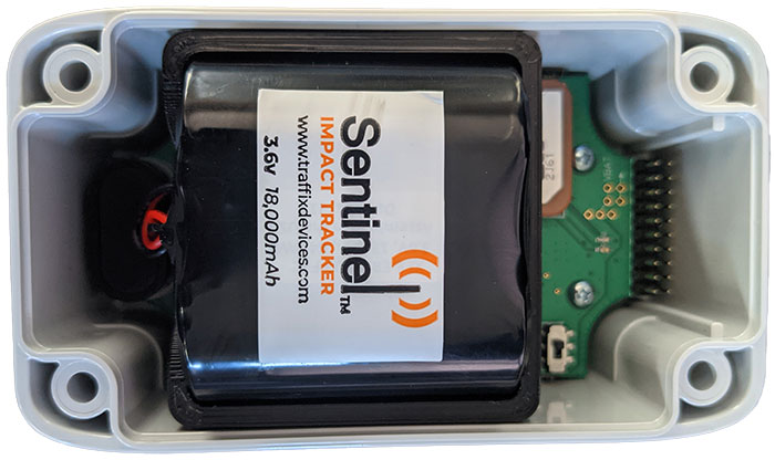 An open Sentinel Impact Tracker with its battery