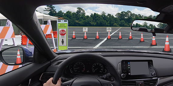 Artists rendition of a Safe Space for drive-thru medical testing using various products from TrafFix Devices, including High Impact Type 2 Folding Barricades, Step-N-Lock reflective Vertical Panels, and TrafFix Enviro-Cone with Clip-on Signs.