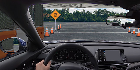 Artists rendition of a Safe Space for drive-thru medical testing using various products from TrafFix Devices, including TrafFix Water-Wall and Water-Wall Fence, Enviro-Cone, and Aluminum Buster Sign Stand with reflective Roll-Up Signs.