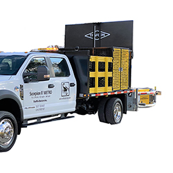 Scorpion II METRO Truck Mounted Attenuator attached to flatbed truck with cone storage and lightboard