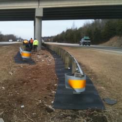 A series of TrafFix Weed Mats setup below an overpass.