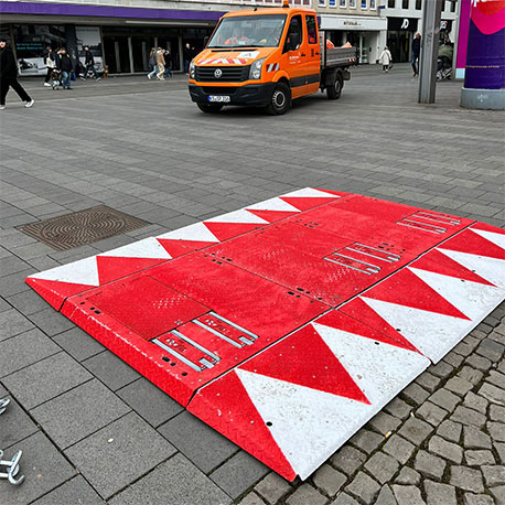 The Above-Ground Vigi Blax in use at a European metro station protecting passengers along side permanent security bollards.