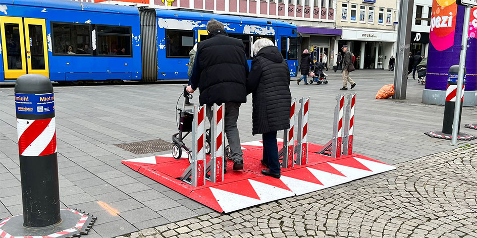 The Vigi Blax security barrier in use at a European urban metro station protecting travelers along side permanent security bollards.