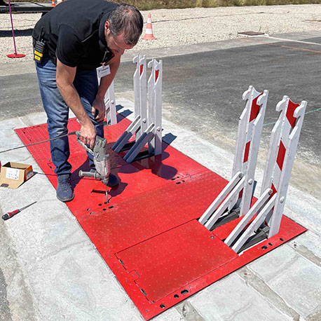 The Vigi Blax vehicle security barrier being installed in-ground at a roadway entry point to secure the perimeter of a facility.